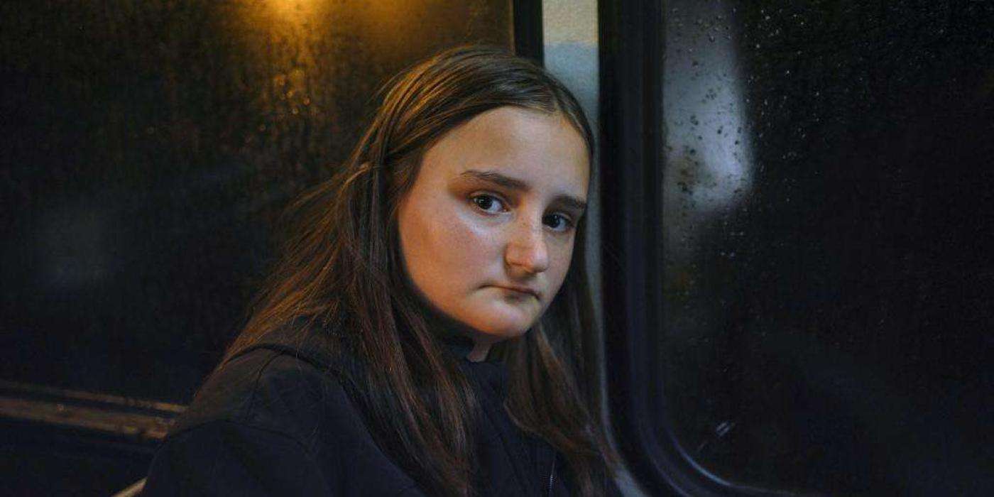 Girl on bus in the dark
